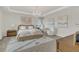 Elegant main bedroom featuring a chandelier, tray ceiling, and neutral decor at 13640 Haulover Beach Ln, Orlando, FL 32827