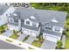 An aerial view displays these modern townhomes with two-car garages and manicured landscaping at 1438 Brookdale Ct, Oviedo, FL 32765