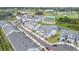 Aerial view of a residential community featuring townhomes, a pond, and well-maintained landscaping at 1438 Brookdale Ct, Oviedo, FL 32765