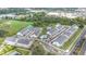 Aerial view of a Primary-planned community with townhomes, a swimming pool, and scenic ponds at 1438 Brookdale Ct, Oviedo, FL 32765