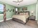 Bright bedroom featuring a ceiling fan, natural light, and comfortable furnishings at 1438 Brookdale Ct, Oviedo, FL 32765