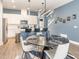 The dining and kitchen areas are adjacent, with a marble table and bar seating at 1438 Brookdale Ct, Oviedo, FL 32765