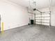 Spacious garage features durable, speckled epoxy flooring and ample room for parking and storage at 1438 Brookdale Ct, Oviedo, FL 32765