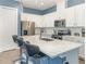 Modern kitchen featuring stainless steel appliances, an island with bar stool seating, and white cabinets at 1438 Brookdale Ct, Oviedo, FL 32765