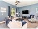 A spacious living room features hardwood floors, high ceilings, and an abundance of natural light at 1438 Brookdale Ct, Oviedo, FL 32765
