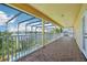 Relaxing balcony offers stunning views of the lake and pool area at 14819 Braywood Trl, Orlando, FL 32824