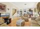 Spacious living room with neutral tones, open to the dining area, featuring a staircase and tile flooring at 14819 Braywood Trl, Orlando, FL 32824