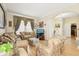 Cozy living room featuring plush furniture, decorative curtains, and a warm, inviting atmosphere at 14819 Braywood Trl, Orlando, FL 32824