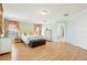 Spacious primary bedroom with hard wood flooring, walk-in closet and neutral paint at 14819 Braywood Trl, Orlando, FL 32824