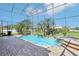 Refreshing pool and spa, enclosed in a screened patio with brick pavers at 14819 Braywood Trl, Orlando, FL 32824
