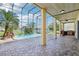 Inviting screened-in pool with a waterfall feature and spacious patio at 14819 Braywood Trl, Orlando, FL 32824