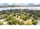 Aerial view featuring the property with a backdrop of a wide river and tree-lined neighborhood at 1511 Crestline St, Orlando, FL 32806
