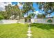 Well-maintained backyard with storage shed and green grass at 1511 Crestline St, Orlando, FL 32806