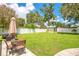 Backyard featuring a charming shed, green grass, and privacy fence at 1511 Crestline St, Orlando, FL 32806