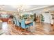 Open floor plan showcases the dining room with wood-look tile flooring seamlessly connecting to the living room at 1511 Crestline St, Orlando, FL 32806