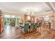 Spacious dining room featuring wood floors, fireplace and access to kitchen and sunroom for entertaining at 1511 Crestline St, Orlando, FL 32806