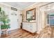 Charming foyer with decorative furniture, wood-look tile floors, and plenty of natural light at 1511 Crestline St, Orlando, FL 32806