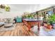 Spacious game room with pool table, plenty of natural light and a comfortable sofa for relaxing at 1511 Crestline St, Orlando, FL 32806