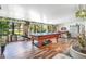 Spacious game room with ping pong table, lots of light and beautiful flooring at 1511 Crestline St, Orlando, FL 32806