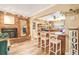 Well-appointed kitchen with an inviting island, rustic brick accents, and bar stool seating at 1511 Crestline St, Orlando, FL 32806