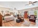 Large main bedroom with hardwood floors, plenty of natural light, and comfortable seating area at 1511 Crestline St, Orlando, FL 32806