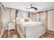 Serene bedroom featuring barn door to bathroom, wood floors, and elegant decor for a relaxing retreat at 1511 Crestline St, Orlando, FL 32806
