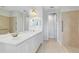 Bathroom featuring double sinks, spacious vanity, and a separate shower area at 1561 Corkery Ct, Winter Springs, FL 32708