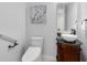 Bathroom featuring a modern vessel sink, decorative vanity, and elegant floral artwork at 1561 Corkery Ct, Winter Springs, FL 32708