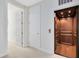 Hallway featuring an elevator with wood paneling and interior lighting at 1561 Corkery Ct, Winter Springs, FL 32708