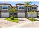 Charming townhome featuring a tile roof, two car garage and landscaped front yard at 1561 Corkery Ct, Winter Springs, FL 32708