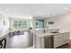 Bright living room with a large window and an open connection to the kitchen at 1561 Corkery Ct, Winter Springs, FL 32708