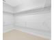 Walk-in closet with ample shelving, carpet flooring, and a neutral color palette at 1561 Corkery Ct, Winter Springs, FL 32708