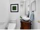 Modern powder room with white fixtures, vessel sink, and elegant vanity with a granite countertop at 1565 Corkery Ct, Winter Springs, FL 32708
