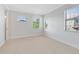 Spacious bedroom features neutral carpeting, white walls and trim, and an abundance of natural light at 1565 Corkery Ct, Winter Springs, FL 32708