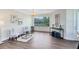 Comfortable living room with hardwood floors, bright windows, stylish decor, and modern furnishings at 1565 Corkery Ct, Winter Springs, FL 32708