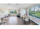 Spacious living area with hardwood floors, large windows, elegant furnishings, and a comfortable seating arrangement at 1565 Corkery Ct, Winter Springs, FL 32708