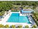 Overhead view of community pool with lounge chairs and covered seating area for residents enjoyment at 1565 Corkery Ct, Winter Springs, FL 32708
