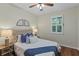 Charming bedroom with natural light, ceiling fan, and stylish decor offers a cozy retreat at 1613 Sapphire Star Dr, Oviedo, FL 32765