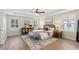 Bright bedroom featuring hardwood floors, plantation shutters, and comfortable seating at 1613 Sapphire Star Dr, Oviedo, FL 32765