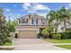 Charming two-story home featuring a spacious garage, landscaped yard, and a welcoming front porch at 1613 Sapphire Star Dr, Oviedo, FL 32765