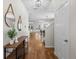 Inviting foyer with hardwood floors, decorative mirrors, and a view into the open living spaces at 1613 Sapphire Star Dr, Oviedo, FL 32765