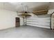 Garage featuring clean epoxy flooring and plenty of storage space for vehicles and tools at 1613 Sapphire Star Dr, Oviedo, FL 32765