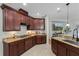 Well-equipped kitchen featuring granite countertops, ample cabinet space, and modern appliances at 1613 Sapphire Star Dr, Oviedo, FL 32765