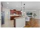 Modern kitchen featuring an island with seating, granite countertops, and stainless steel appliances at 1613 Sapphire Star Dr, Oviedo, FL 32765