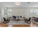 Well-lit living room with stylish seating, area rug, and a modern light fixture at 1613 Sapphire Star Dr, Oviedo, FL 32765