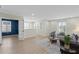 Bright living room with hardwood floors, plantation shutters, and comfortable seating at 1613 Sapphire Star Dr, Oviedo, FL 32765