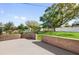 Private backyard featuring a large patio, lush lawn and mature trees at 1725 Marcia Dr, Orlando, FL 32807