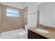 Bathroom featuring tiled shower and bath, granite countertop vanity, and neutral finishes at 1725 Marcia Dr, Orlando, FL 32807