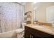 Bathroom with granite countertop vanity, bathtub with shower and decorative shower curtain at 1725 Marcia Dr, Orlando, FL 32807
