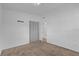 Bedroom with carpet floors, closet and doorway entrance, and neutral color palette at 1725 Marcia Dr, Orlando, FL 32807